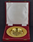 A Queen Elizabeth II silver gilt 'The Tudor Rose Dish' a replica of the St Georges Chapel, Windsor
