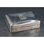 A George V silver cigarette box, of hinged rectangular form the cover embossed with a Crown