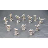 An interesting set of twelve Italian 800 grade white metal place card/setting holders, formed as