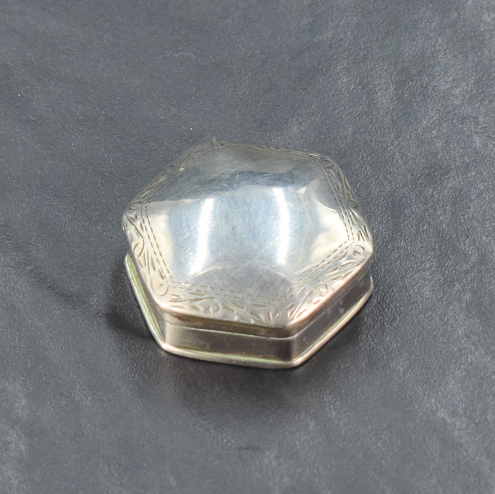 An imported silver 19th century design pill box, of domed and hinged hexagonal form with engraved