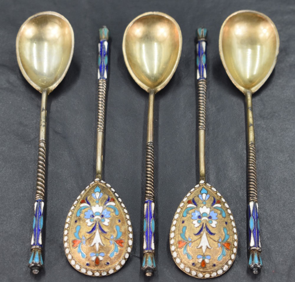 A group of five late 19th/early 20th century Russian enamelled gilt metal spoons, the tear-drop