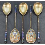 A group of five late 19th/early 20th century Russian enamelled gilt metal spoons, the tear-drop