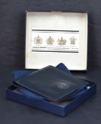A rare Gerald Benney silver and leather presentation wallet, given by Charles III when Prince of