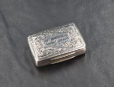 A Regency period silver vinaigrette, of hinged rectangular form with engraved foliate detail and