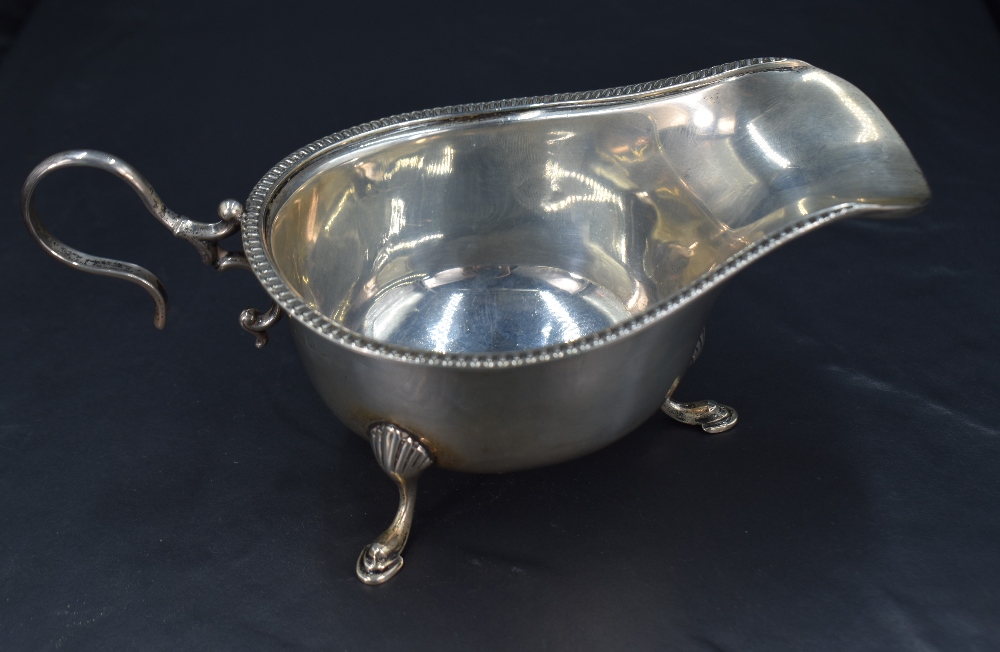 A George V silver sauce or gravy boat, of traditional design with egg-and-dart moulded rim, generous - Image 2 of 4