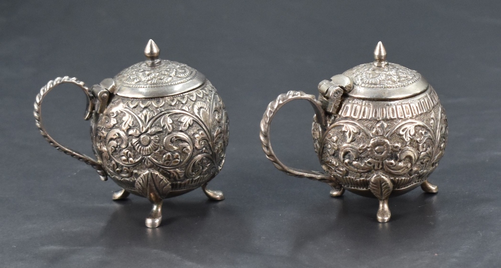 A pair of white metal (possibly colonial Indian) condiment pots, one slightly smaller and of - Image 2 of 3