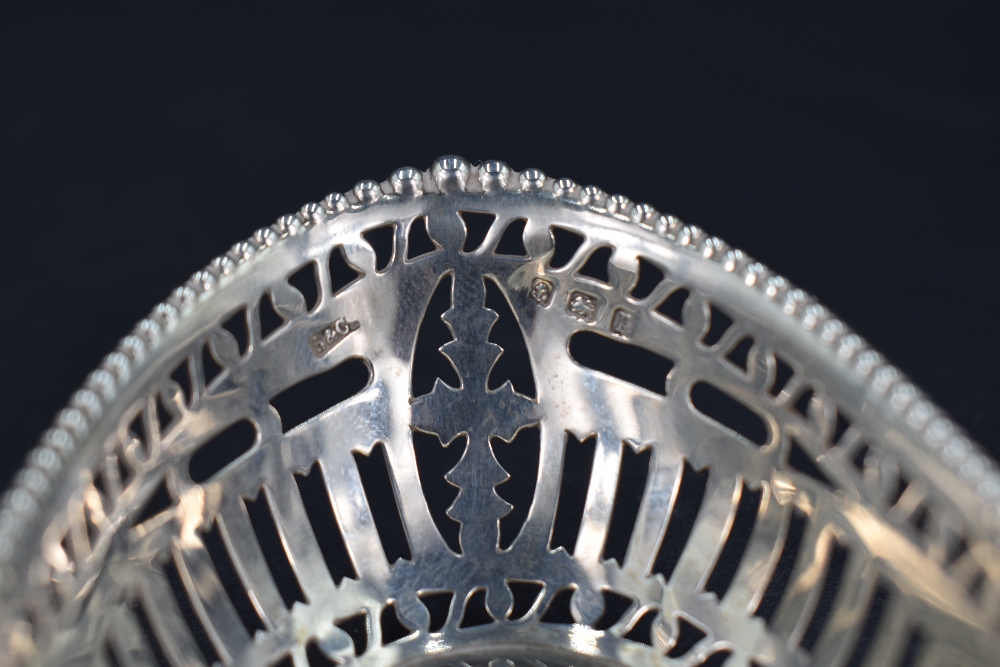 An Edwardian silver dish, of oval form with scroll-pierced and fluted booge, marks for London - Image 3 of 4