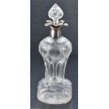 A George V silver mounted moulded and engraved glass 'Glug-Glug' decanter, having a foliate engraved