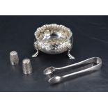 An Edwardian silver salt, of traditional design with gadrooned and flared rim, foliate embossed body
