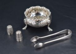 An Edwardian silver salt, of traditional design with gadrooned and flared rim, foliate embossed body