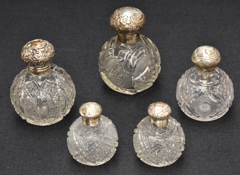 A collection of five silver mounted cut glass scent bottles of various size and design, three having - Image 2 of 6
