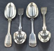 A group of four 19th century silver table spoons, two of fiddle and thread pattern having engraved