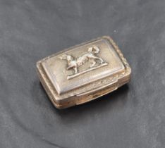 A Regency period silver vinaigrette, of hinged rectangular form with prancing canine motif in relief
