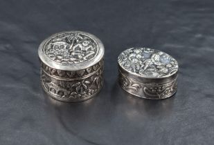 A .925 grade imported Hanau silver pill box, of oval hinged form decorated with classical figural