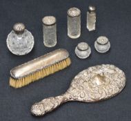 A selection late 19th and early 20th century silver mounted dressing table wares, including four cut