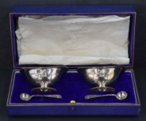 Two early 20th century silver navette shaped pedestal condiment dishes, having beaded rims and