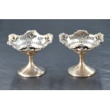 A pair of George V silver pedestal bon bon dishes, of shaped and dished circular form with