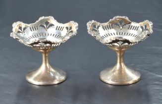 A pair of George V silver pedestal bon bon dishes, of shaped and dished circular form with