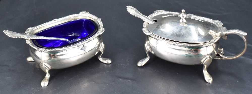A pair of George VI silver condiments, comprising salt and mustard, each of rounded rectangular form