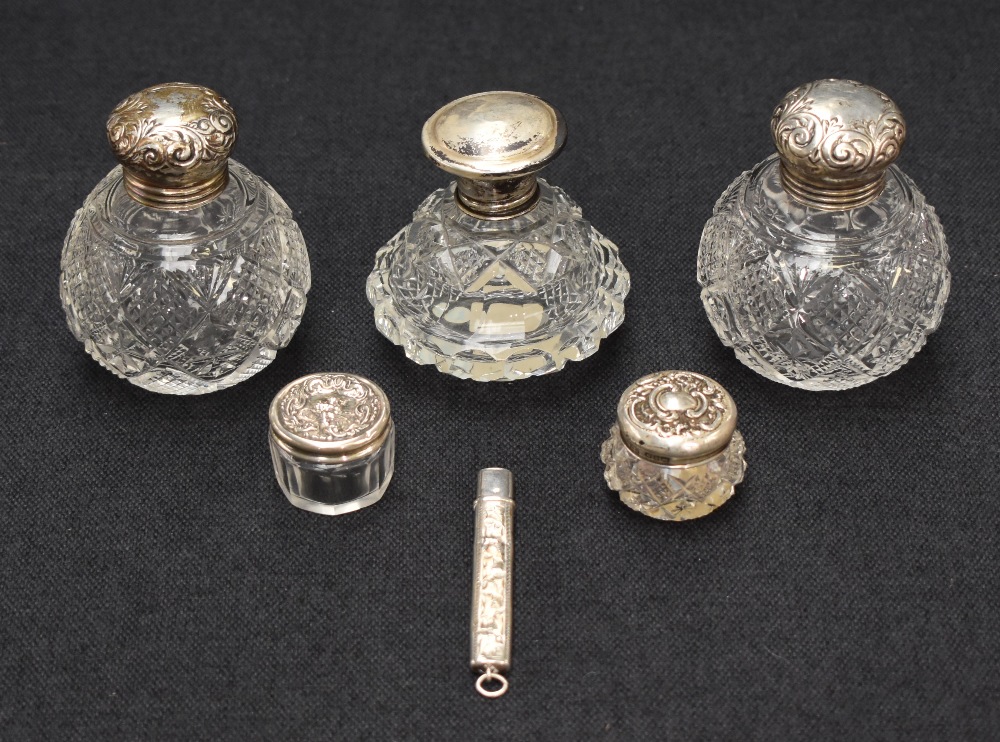 Three silver mounted cut glass scent bottles of various size, age and design, all having embossed - Image 2 of 2