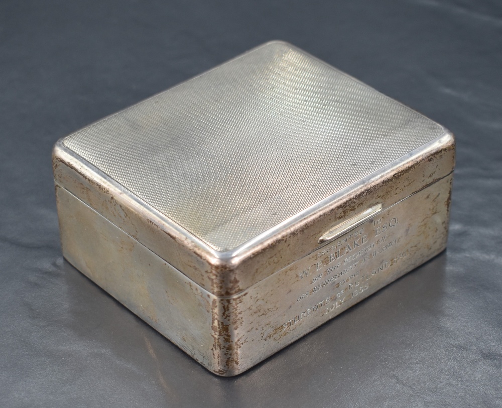 An early Queen Elizabeth II silver cigarette box, of hinged rectangular form with engine-turned