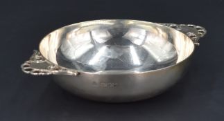 A George VI silver quaich, of traditional design with stylised scroll and pierced shell design