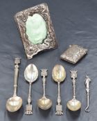 A group of five French .800 grade white metal souvenir spoons, each surmounted with armorial