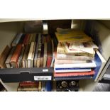 A shelf of vintage and modern books, including 1928 first edition of Prince Charlie and the border