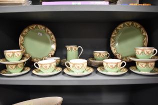 A collection of circa 1912 Royal Worcester table ware, having green and cream ground with brown swag