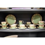 A collection of circa 1912 Royal Worcester table ware, having green and cream ground with brown swag