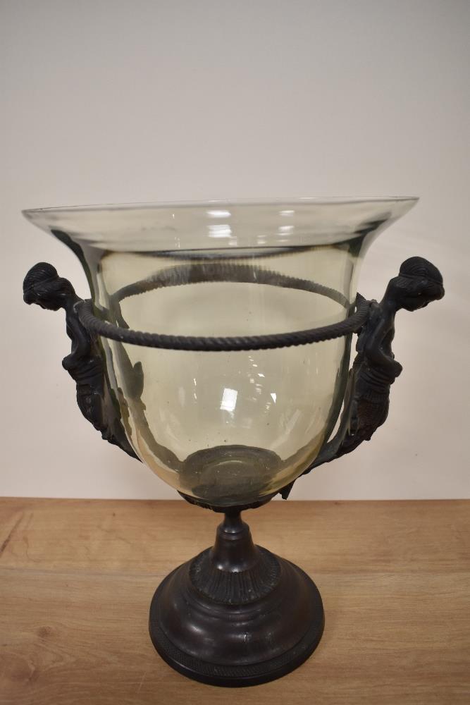 A 20th Century cast metal table centre, of Greek design, measuring 34cm tall