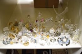 A collection of glass animal studies, vase and figurines, including clocks and paper weights.