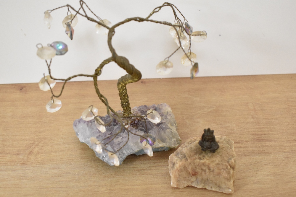 A novelty solid brass lucky pixie pipe tamper set within a quartz rock together with a wire gemstone