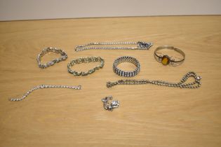 A collection of paste set costume jewellery including necklaces, bracelets and a silver cuff