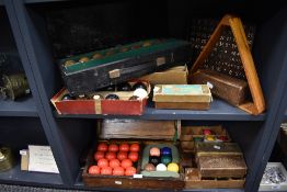 A quantity of vintage billiards balls, scoreboard, and other items