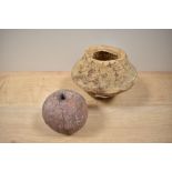 A medieval cannon ball, diameter 8cm, and a terracotta coloured pot