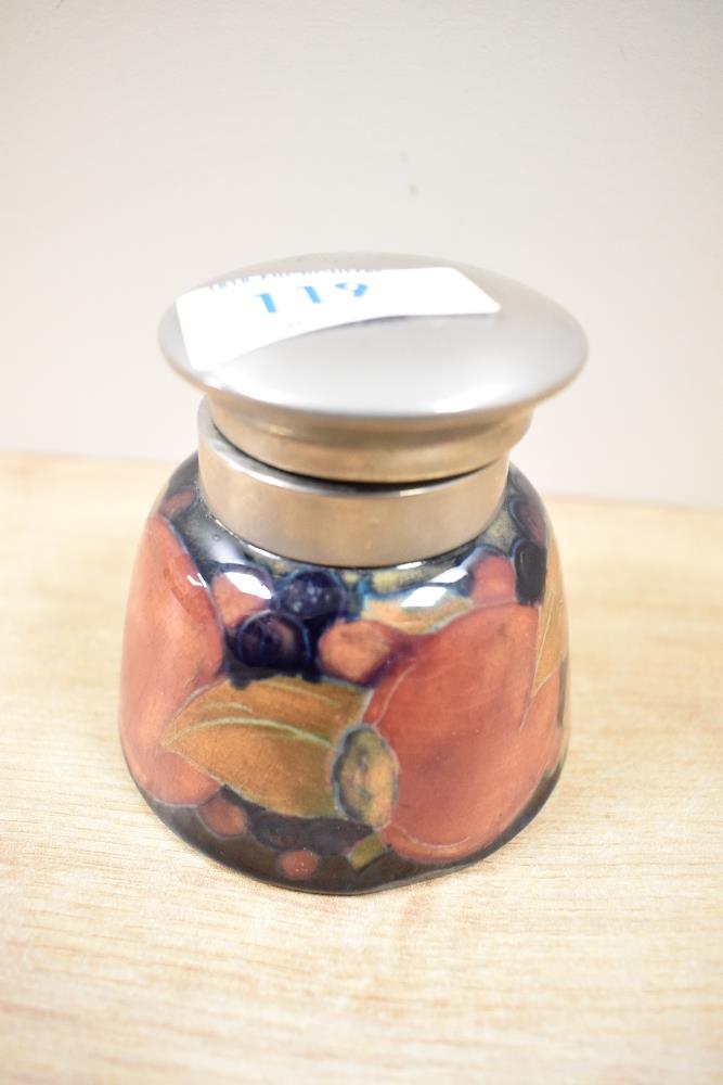 An early to mid 20th century Moorcroft Pottery inkwell, having blue ground with tube lined fruit