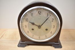 A 1930s bakelite cased mantel clock, Enfield, Made in England.