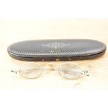 A pair of Antique spectacles with inlaid wooden case.