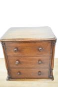 A Victorian mahogany miniature three drawer table top chest of drawers, measuring 20cm x 28cm x