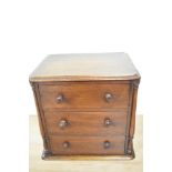 A Victorian mahogany miniature three drawer table top chest of drawers, measuring 20cm x 28cm x