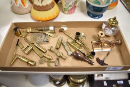 A miscellany of brass trinkets, including padlock, was sealing stamp, glass cutter, miniature