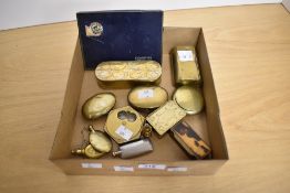 A collection of antique brass snuff boxes, one having engraved initials, miniature flasks and a