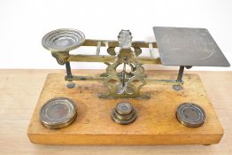 A set of 19th Century mahogany and brass postal scales, S.Mordan & Co., with weights, measuring 25cm