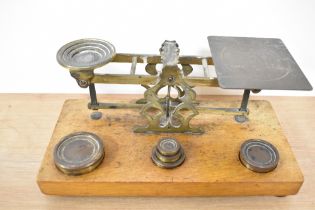 A set of 19th Century mahogany and brass postal scales, S.Mordan & Co., with weights, measuring 25cm