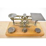 A set of 19th Century mahogany and brass postal scales, S.Mordan & Co., with weights, measuring 25cm