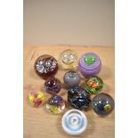 A selection of paperweights, including Caithness miniature pansy.