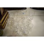 A collection of antique glasses, including etched and wine glasses and tumbler with etched logo; '