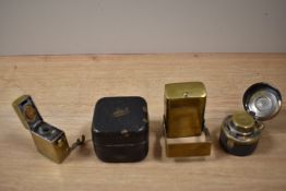 A group of four Victorian and later brass travelling inkwells, the largest measures 6cm tall