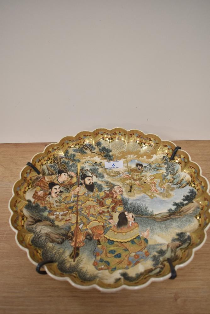 A 19th Century Japanese Satsuma ware charger, of lobed outline, and decorated with figures and